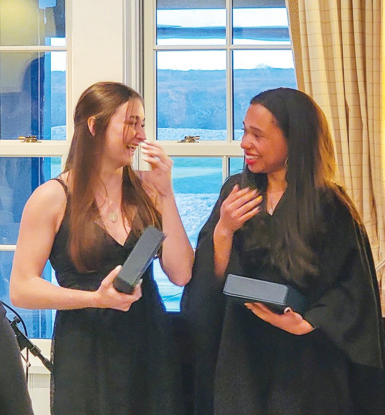 Sarah Hanlon, left, and Maryann Vasquez-Cruz were overcome with joy last Wednesday on learning they had each won a four-year full-tuition scholarship to the college of their choice. Hanlon is deciding between Providence College and Bates College, while Vasquez-Cruz&rsquo;s choices are Massachusetts College of Pharmacy or Duke University in China.