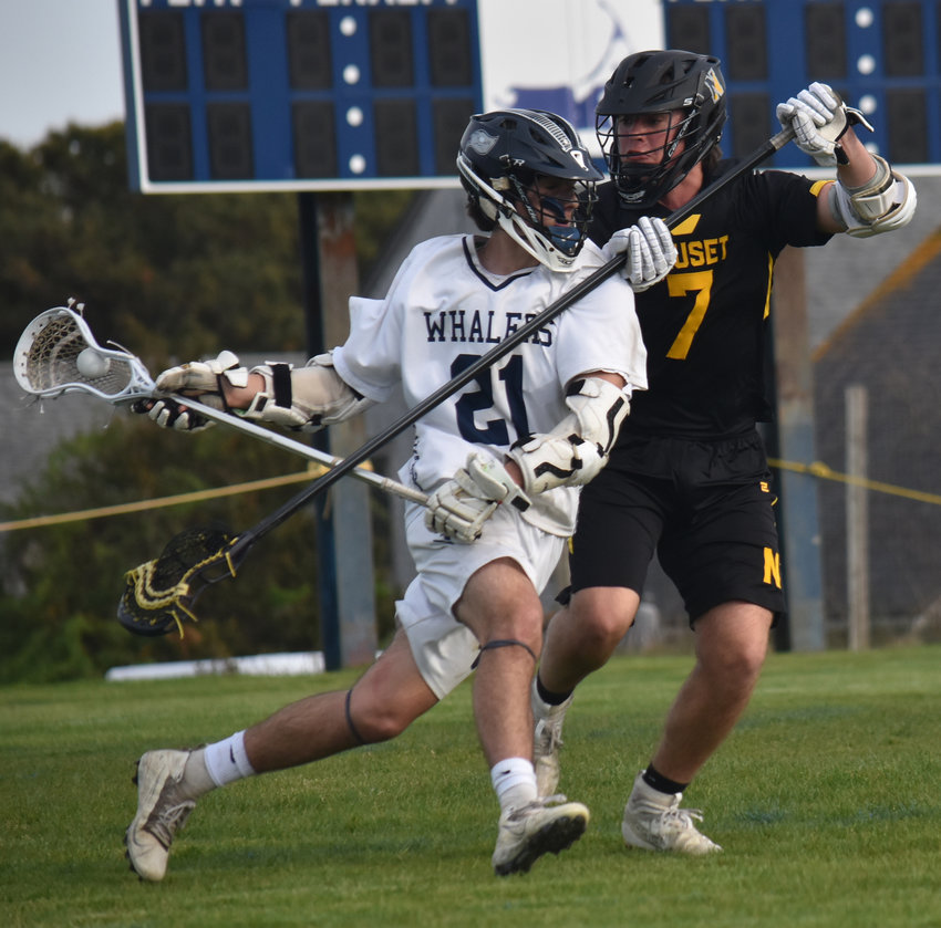 Colton Chambers works past a Nauset defender during Thursday&rsquo;s game. The sophomore led the Whalers with four goals in the 15-10 loss.