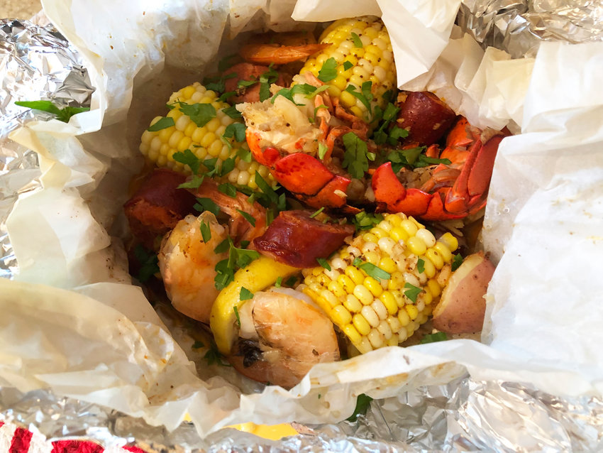 This recipe inspired by Yankee Magazine calls for &ldquo;grill pouches&rdquo; filled with classic seafood and vegetables.