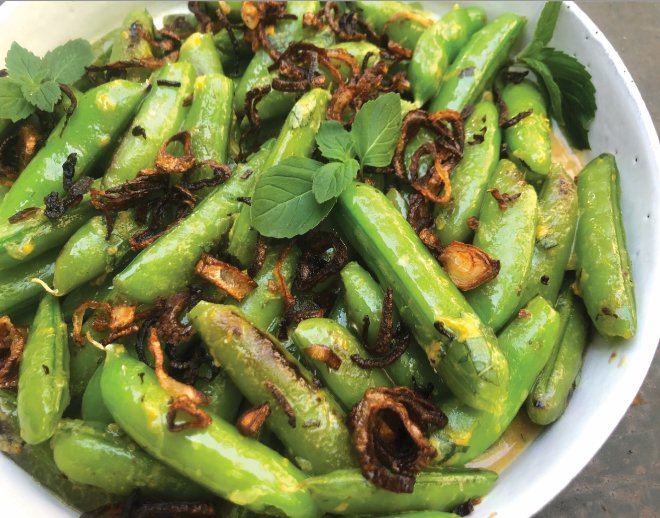 Blistered sugar snap peas dressed with orange, mustard, mint and frizzled shallots.