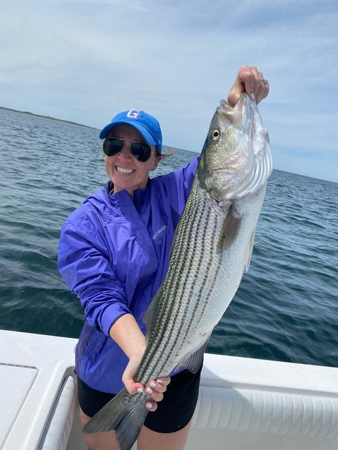 Jen Maxwell with a large striper she caught off the south shore this week.