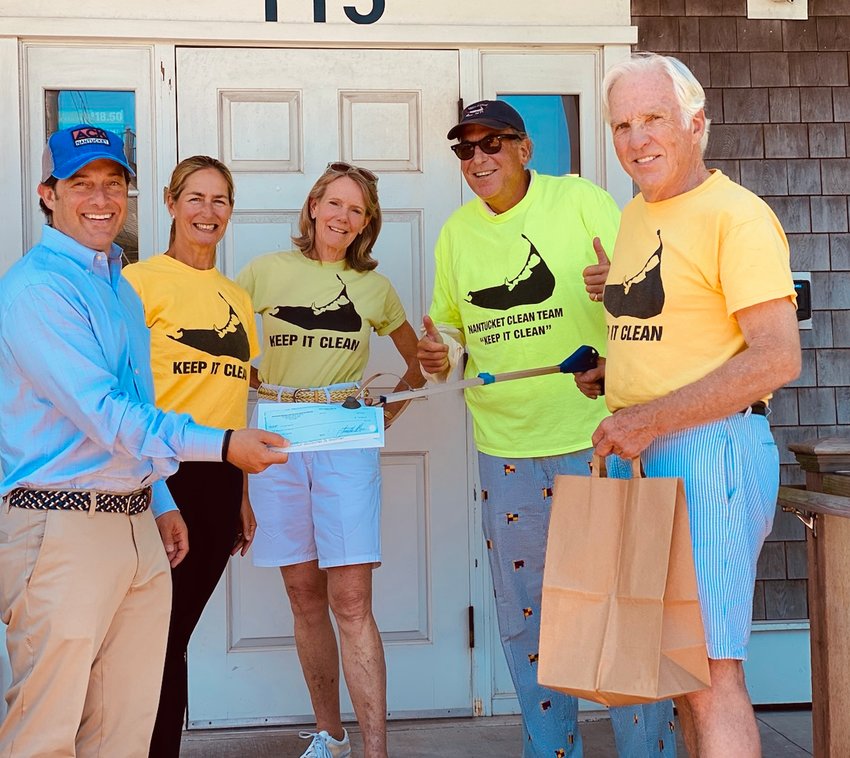 The New England Convenience Store and Energy Marketers Association donated $10,000 to the Nantucket Clean Team Wednesday. From left, NECSEMA executive director Jonathan Shaer, Clean Team volunteers Deb Feldman, Anne Dewez and Adam Dread, and founder Bill Connell.