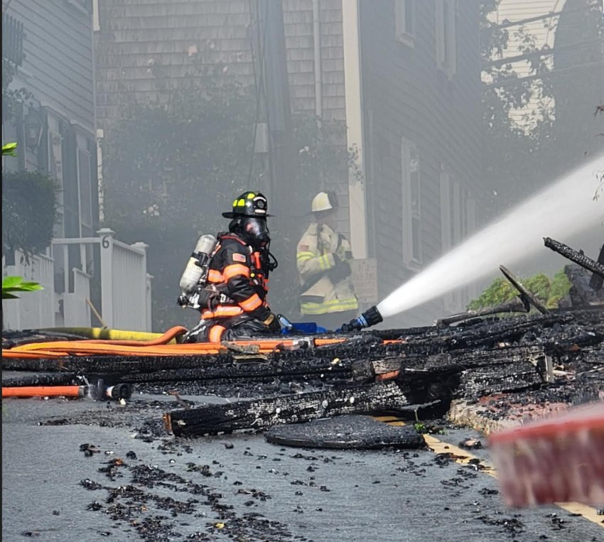 Firefighters battle the blaze Saturday morning.