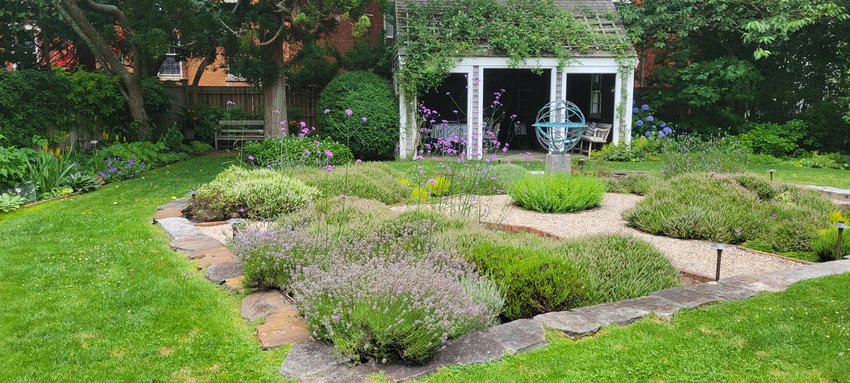 The garden at The Cobbles on Main Street, a blend of stonework and plantsmanship. The heather will be at peak bloom Wednesday for the Nantucket Garden Club&rsquo;s annual House and Garden Tour.