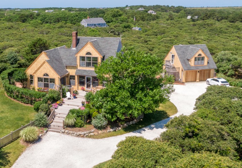 Sitting on nearly three acres of land in Tom Nevers East, this four-bedroom, three-and-a-half-bathroom Whitetail Circle home is surrounded by hundreds of acres of conservation land.