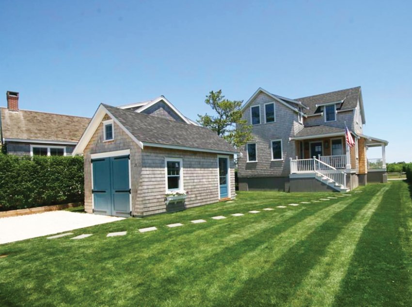Located in the heart of Brant Point, this four-bedroom, four-and-a-half bathroom home sits on just over a tenth of an acre with a large yard and a garage.