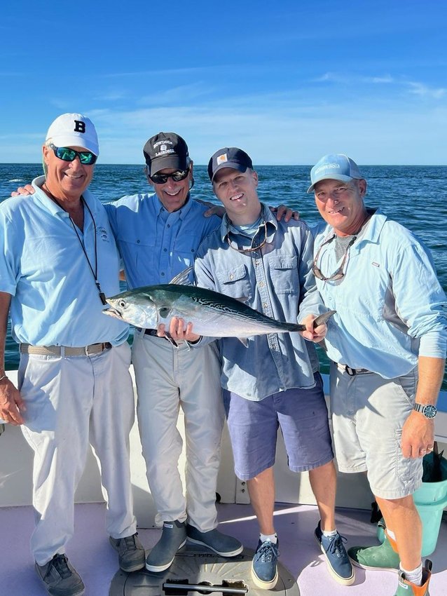 Tom Mleczko, Peter Grua, Alex Duncan and Nat Reeder with an albacore on the east side of the island.