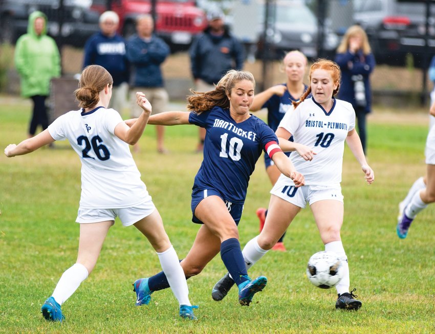 Midfielder Claire Misurelli dribbles between a pair of Bristol-Plymouth defenders. She was pivotal in controlling possession in the Whalers&rsquo; win.