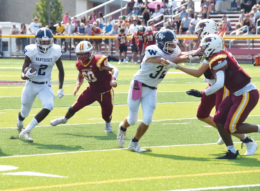 Griffin Fox blocks as running back Jayquan Francis turns the corner in the Whalers&rsquo; 12-0 loss to Cardinal Spellman on the road Saturday.