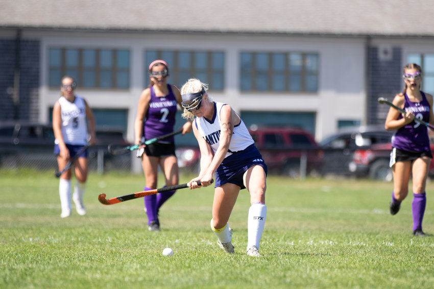 Caroline Allen lines up to drive the ball downfield Saturday against Martha&rsquo;s Vineyard. The field hockey team was the only Nantucket team on Saturday to prevail against its top rival, winning 2-1.