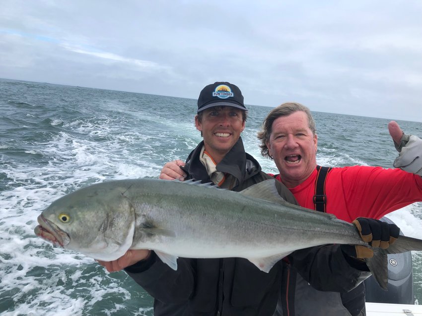 Cam Gammill and Chip Cunningham with a big bluefish on the east side of the Island this week.