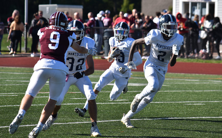 Sean Murphy carries the ball behind blockers Griffin Fox and Jayquan Francis in the Whalers&rsquo; 43-8 loss to West Bridgewater Saturday.