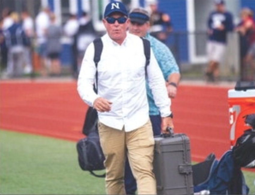 Whalers&rsquo; play-by-play man Scott Capizzo carries his radio gear onto the field in Sandwich last season.