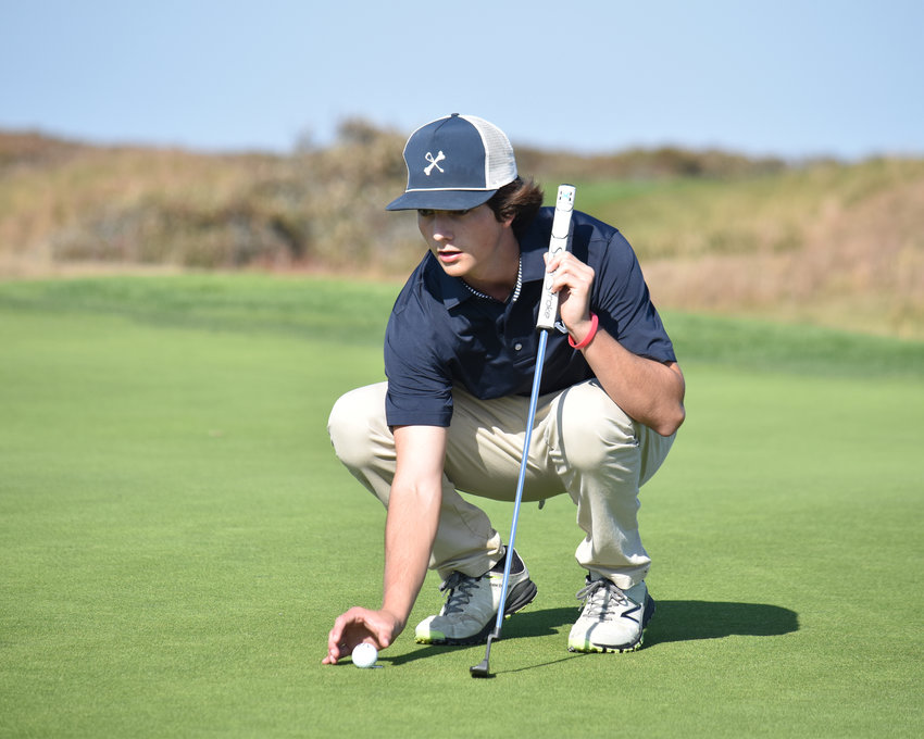 Cole Chambers reads the green last Wednesday at Nantucket Golf Club. The junior led the Whalers with an 89 at Monday's south sectional tournament at Foxborough Country Club.