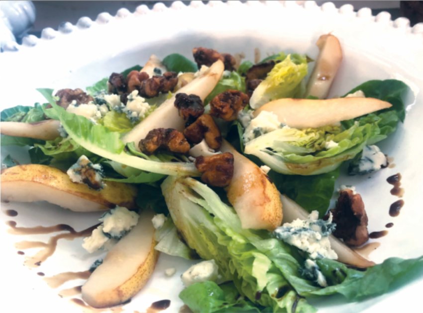 Candied walnuts add flair to this classic pear, blue cheese and seasonal-greens salad that can be prepared for a gathering or dinner for two.