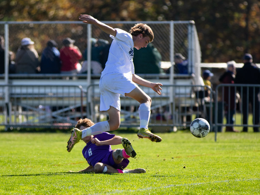 Jake Johnson leaps over a Vineyard slide tackle in Saturday&rsquo;s 3-0 loss.