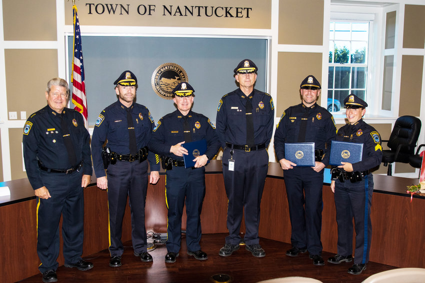 From left, police chief Bill Pittman, Lt. Angus MacVicar, new Lt. Daniel Mack, deputy chief Charlie Gibson, and new sergeants Robert and Jacquelyn Hollis at Tuesday's promotion ceremony.