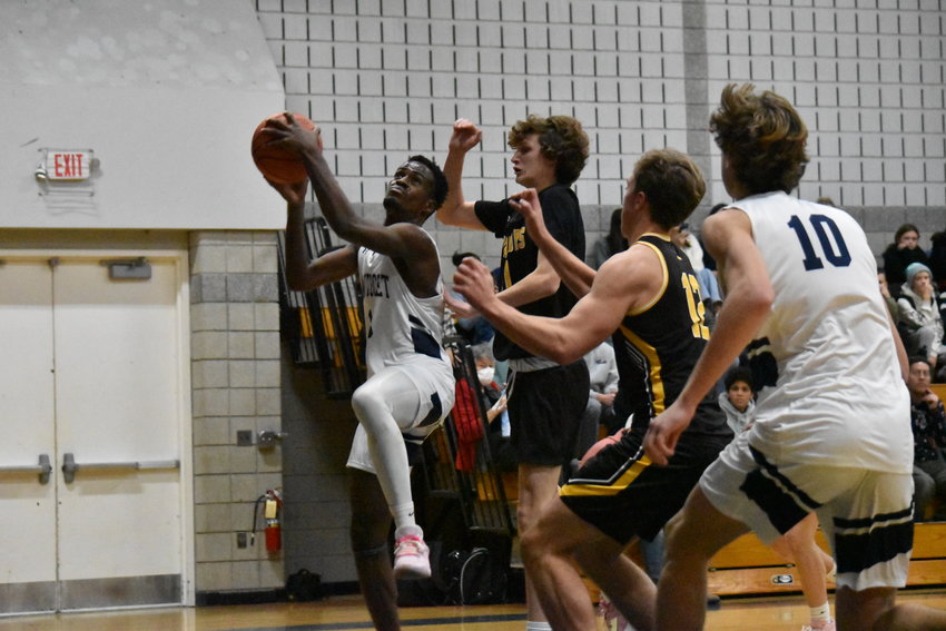 Jayquan Francis drives to the basket during Thursday's home opener against Nauset.