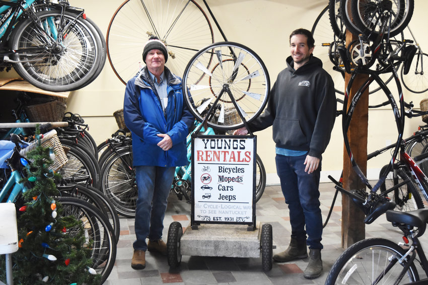 Harvey Young, left, has turned over the reins of the family business, Young&rsquo;s Bicycle Shop, to his son Jasper, right.