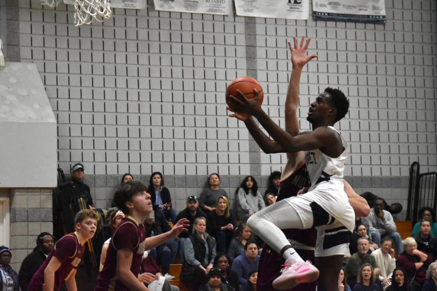Jayquan Francis drives to the hoop during Saturday's game against Millbury.