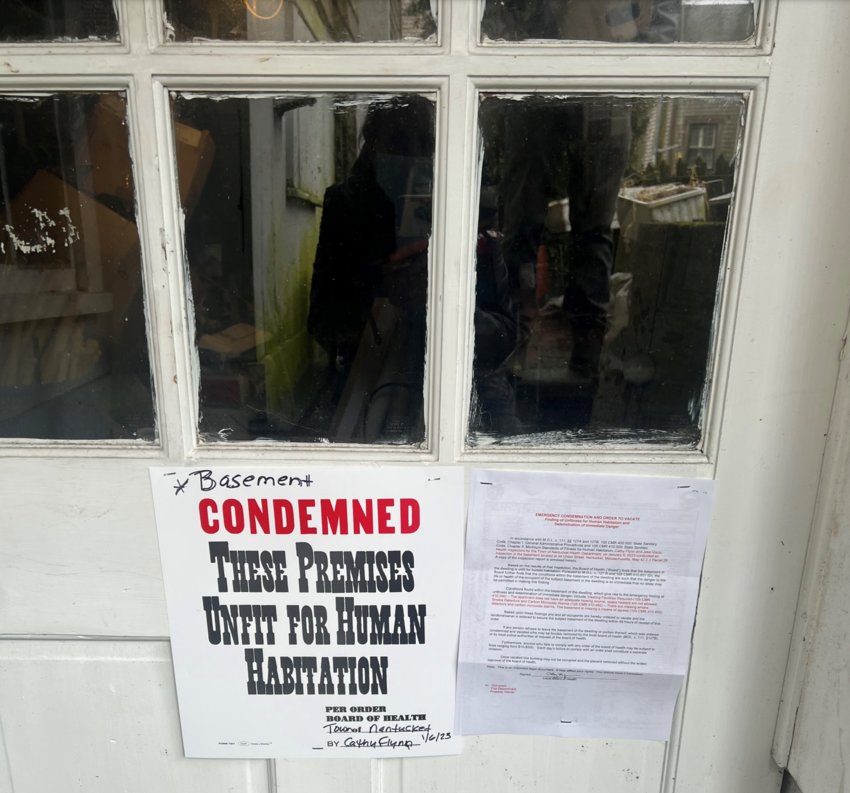 The condemnation notice on the basement door of 44 Union St.