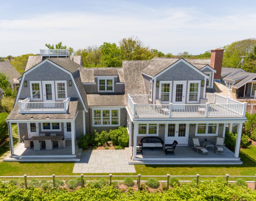 Located off prestigious Cliff Road, just steps from historic downtown Nantucket, the island&rsquo;s best shops and restaurants, and around the corner from an abundance of family-friendly beaches, this four-bedroom, five-and-a-half bathroom home has sweeping harbor views.