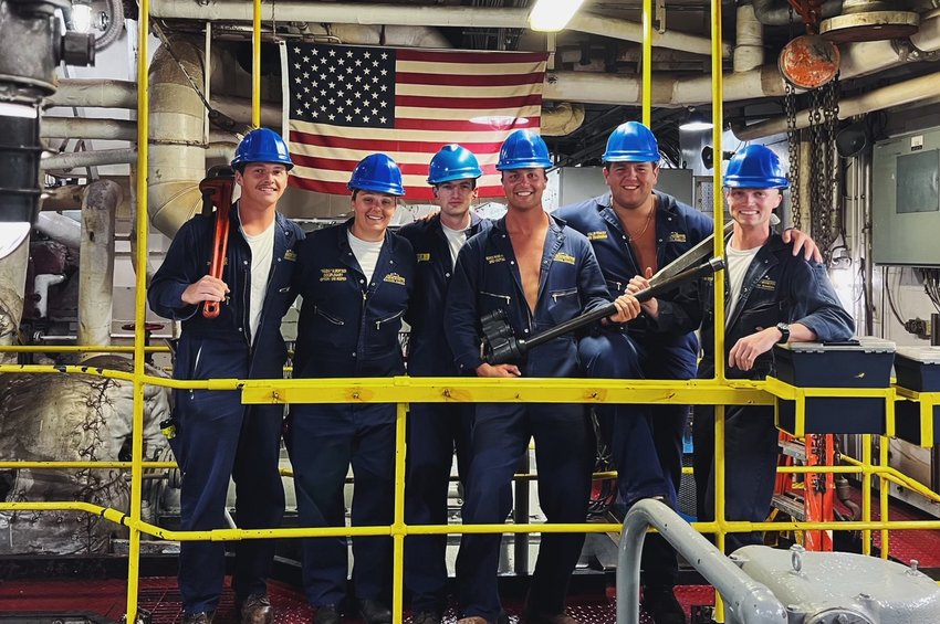 Nantucket High School graduate Paige Albertson, second from left, in the engine room of the TS Kennedy with the other seniors on her watch team.