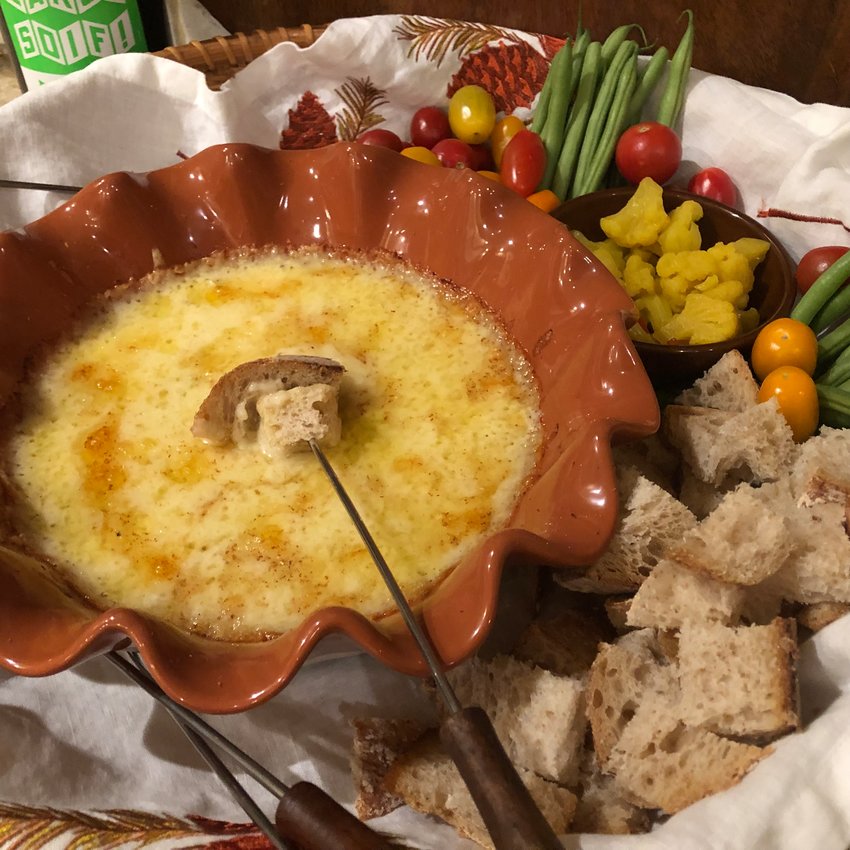 &ldquo;The Snowy Cabin Cookbook&rsquo;s&rdquo; Foolproof Fondue is baked in a shallow gratin dish instead of heated in a fondue pot, and served with bread cubes and vegetables.
