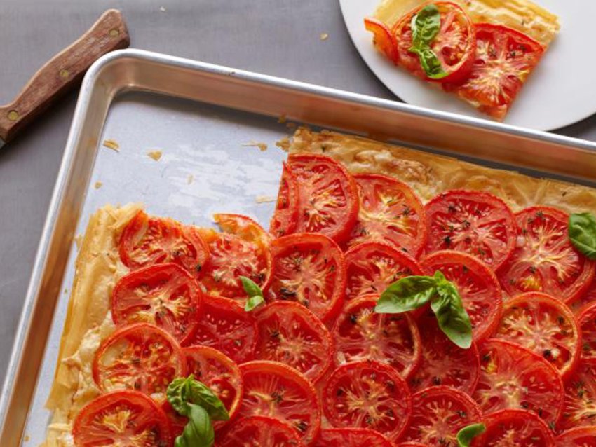 This tomato tart uses filo as a base. The trick is brushing the filo with Dijon mustard and draining the tomatoes well.