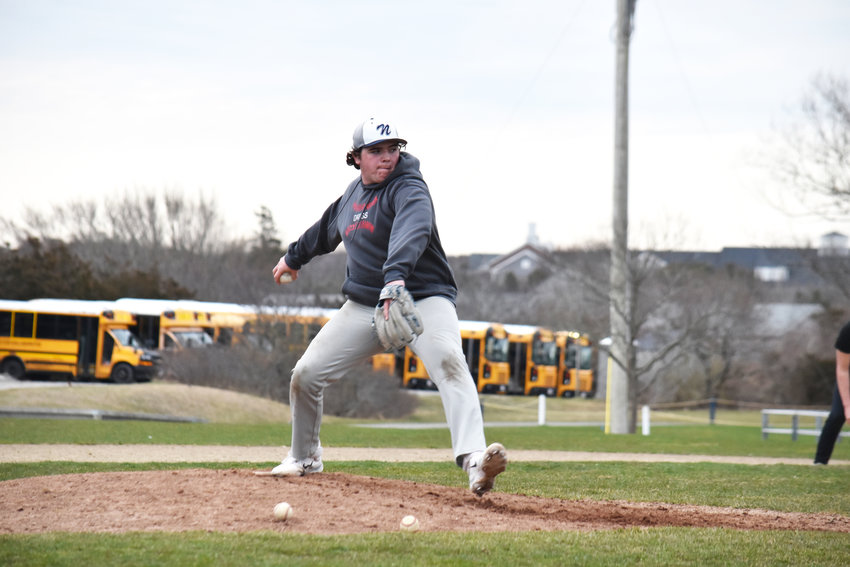 Colin Lynch delivers a pitch during Monday&rsquo;s baseball practice. The senior captain will be a team leader on the mound and at the plate.