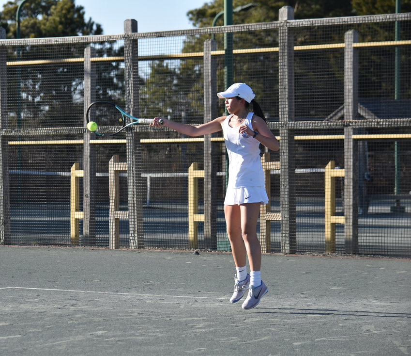 Lauren Cutone returns a serve during Monday's match against Bishop Connolly. Cutone won her first singles match in three sets.
