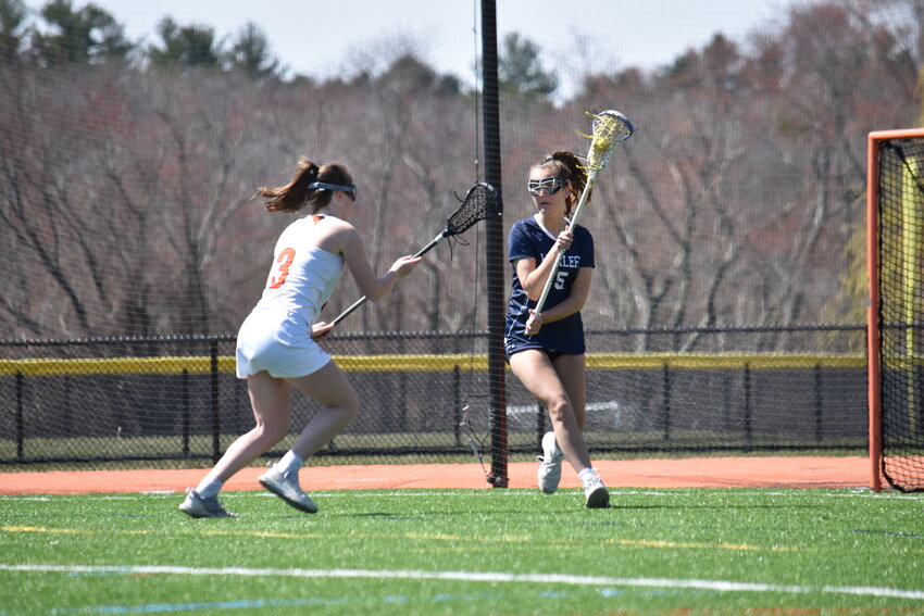 Evelyn Stahl looks for a pass during the Whalers&rsquo; April 8 game at Wayland. The Whalers moved to 4-2 on the season with a win Saturday at Lexington.