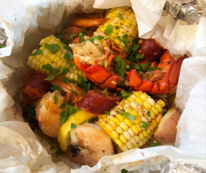 This recipe inspired by Yankee Magazine calls for &ldquo;grill pouches&rdquo; filled with classic seafood and vegetables.
