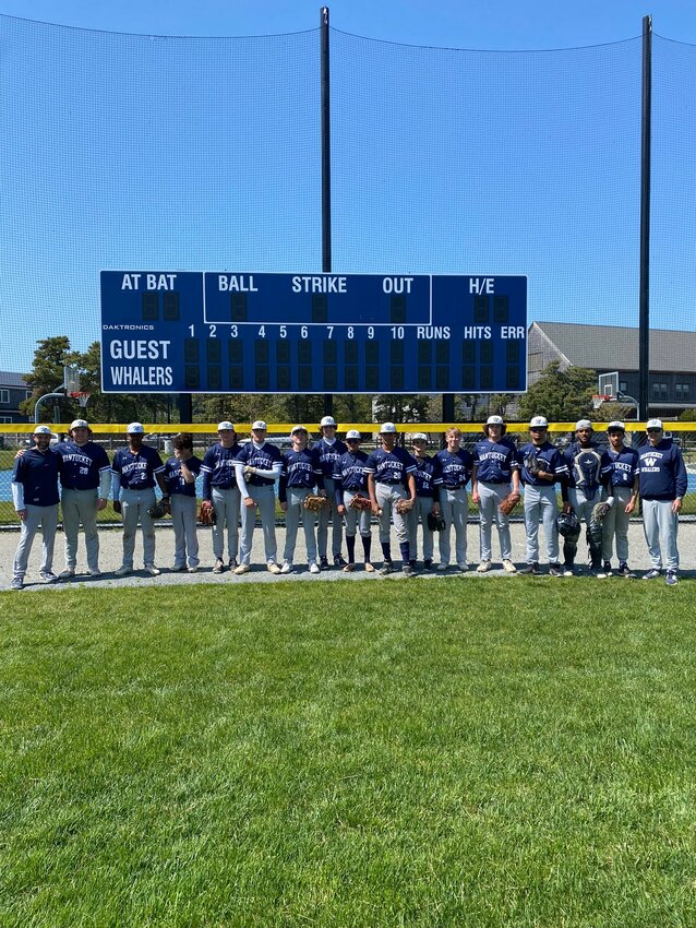 The varsity baseball team in front of the scoreboard at the Whalers&rsquo; new home on Backus Lane.