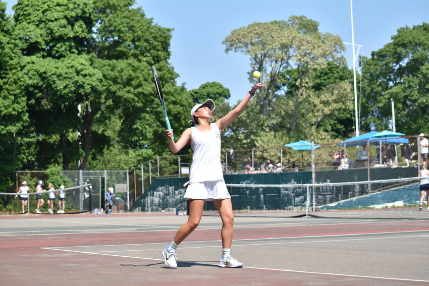 Lauren Cutone lines up a serve during Friday's playoff match at Cohasset. The junior earned the Whalers' lone win on the day in second singles.