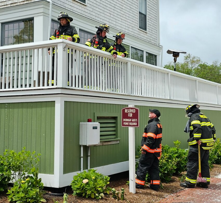 Nantucket firefighters check the deck and surrounding area at the Nantucket Hotel Monday.