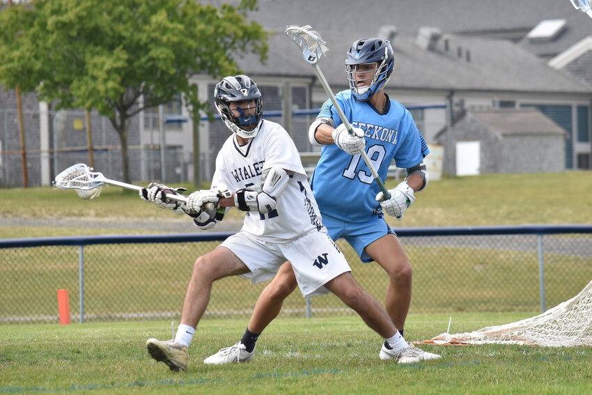 Cole Chambers looks for a pass during the Whalers' 16-0 win over Seekonk in the Div. 4 round of 32 Monday. The junior finished the game with four goals, including the 100th goal of his varsity career.