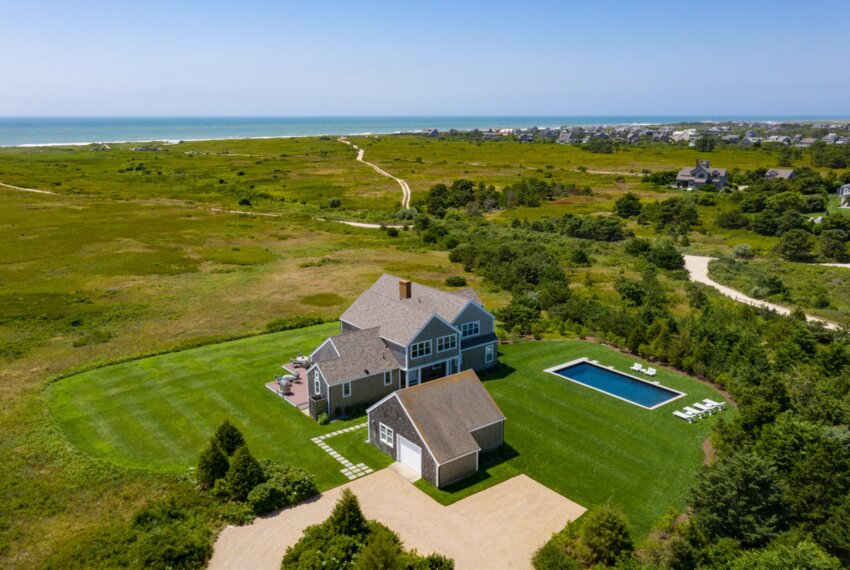 This five-bedroom, four-and-half-bathroom home sits on 1.84 acres in the sought-after Cisco neighborhood on the south shore, surrounded by protected open space with picturesque water views.