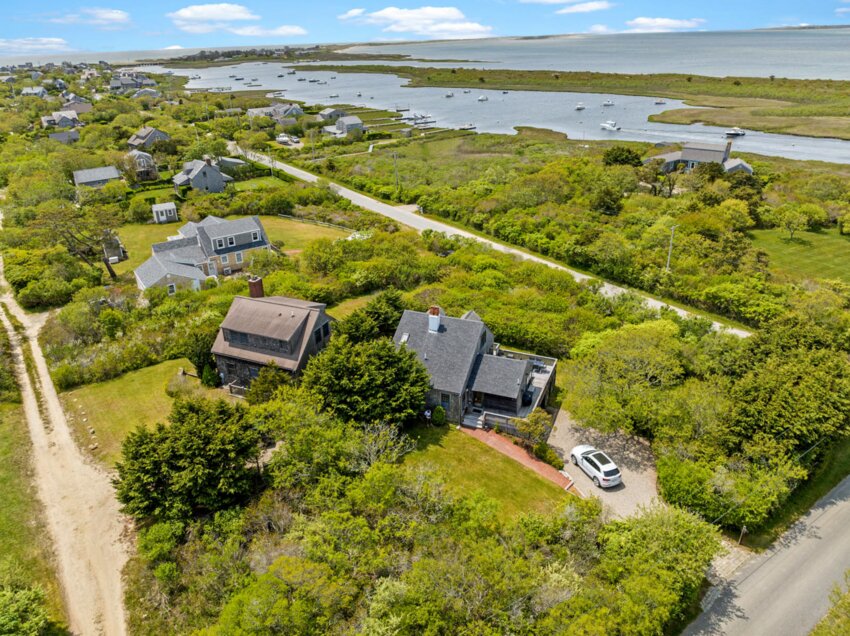 Located on the far west end of the island, these two Madaket homes sit side by side, both with water views.