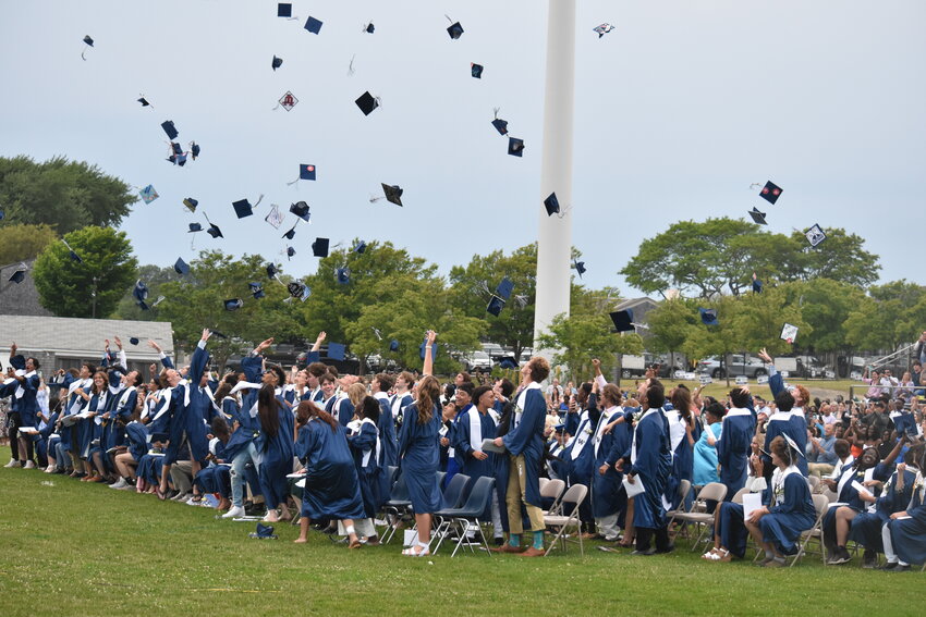 The Nantucket High School class of 2023 tosses their caps at the end of Friday's graduation ceremony.