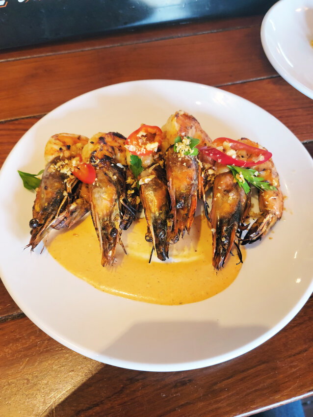 Chef Liam Jacobs&rsquo; peri peri prawns are gently grilled and served over a spicy chile aioli. There are enough for an app to share or an entr&eacute;e.