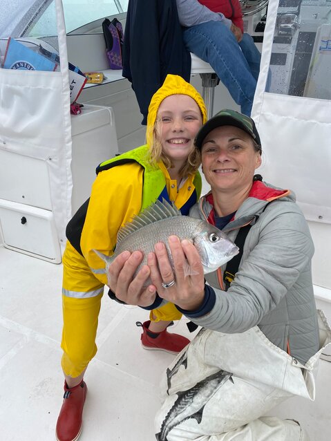 Rosey and Christy Bassett Baker with a fresh-caught scup.
