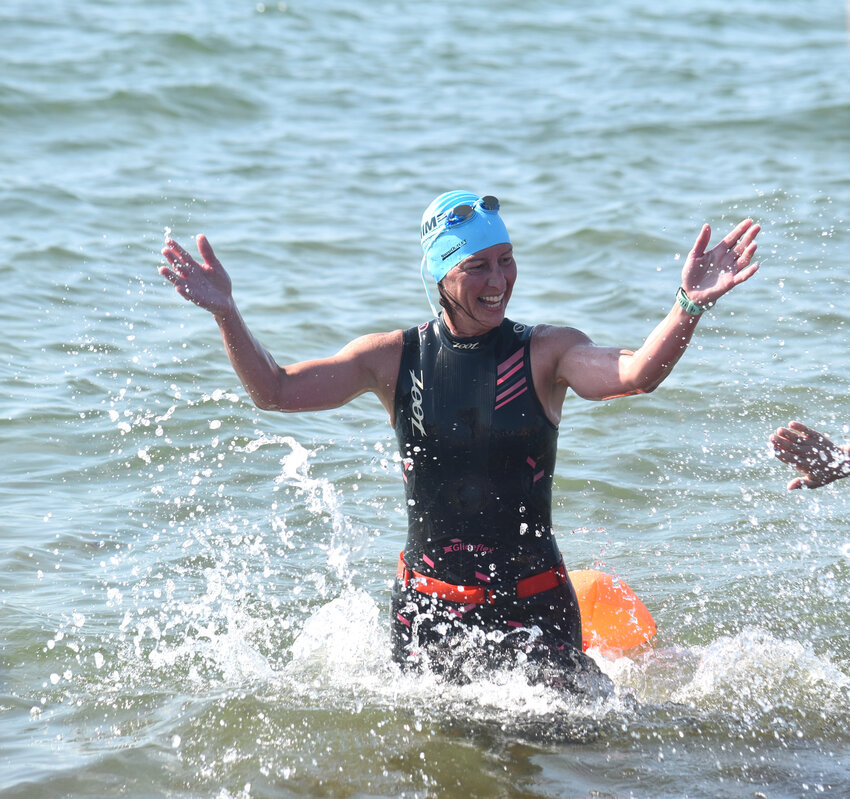 Oncology nurse Gretchen Hull celebrates after completing her swim during last year&rsquo;s Swim Across America-Nantucket.