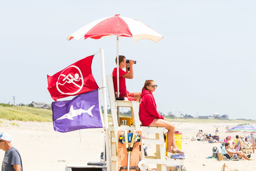 Nantucket lifeguards scan the waters along the south shore for sharks last summer.
