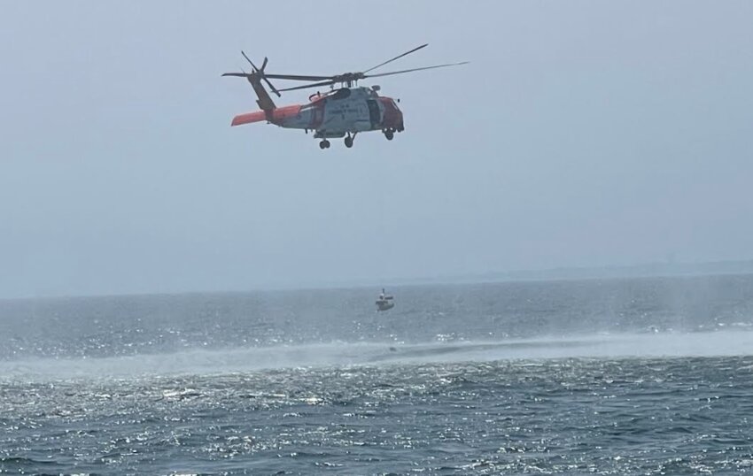 A Coast Guard helicopter from Air Station Cape Cod and patrol boat from Station Brant Point helped rescue three fishermen from the water east of Nantucket Saturday after their boat sank.