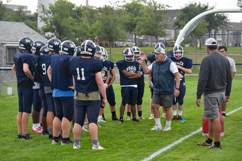 Assistant coach Vaughan Machado addresses the Whalers&rsquo; linemen during Monday&rsquo;s football practice.
