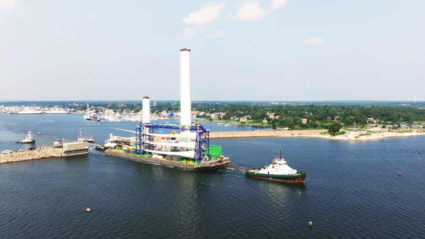 A Vineyard Wind turbine is barged out of New Bedford Harbor last week.
