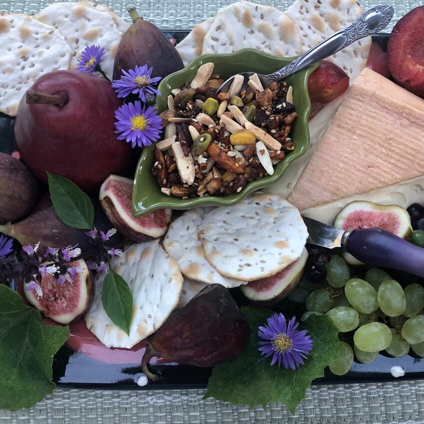 This version of a Sweet Dukkah Spice Blend chock full of nuts and seeds accompanies a fruit and cheese platter.
