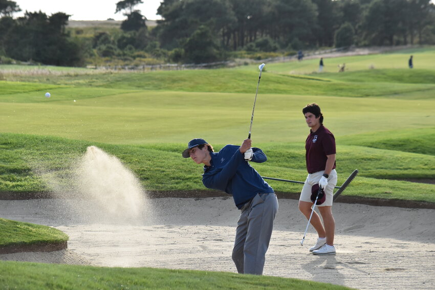 Jack Halik hits out of the bunker Friday at Miacomet during the Whalers' win over Falmouth.