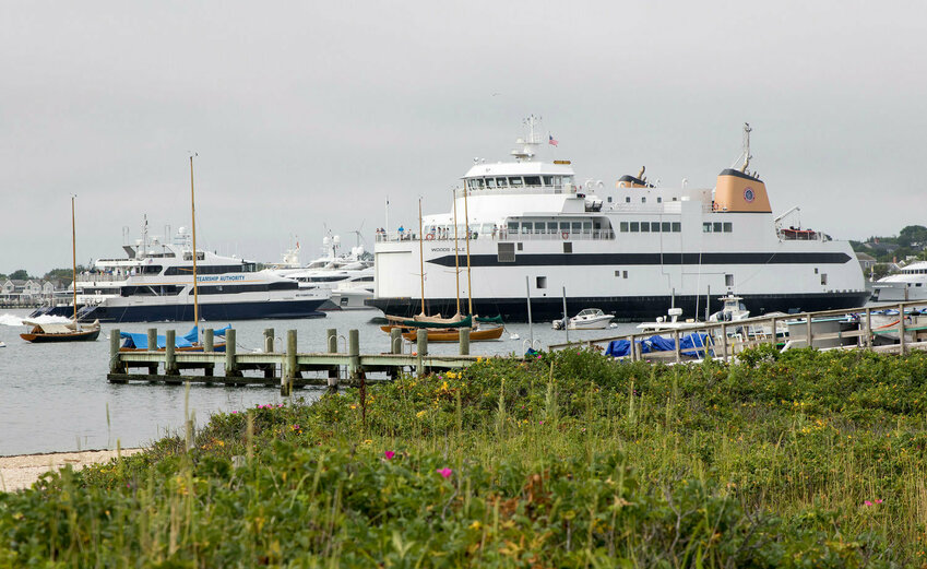 Steamship Authority vessels enter and exit Nantucket Harbor.